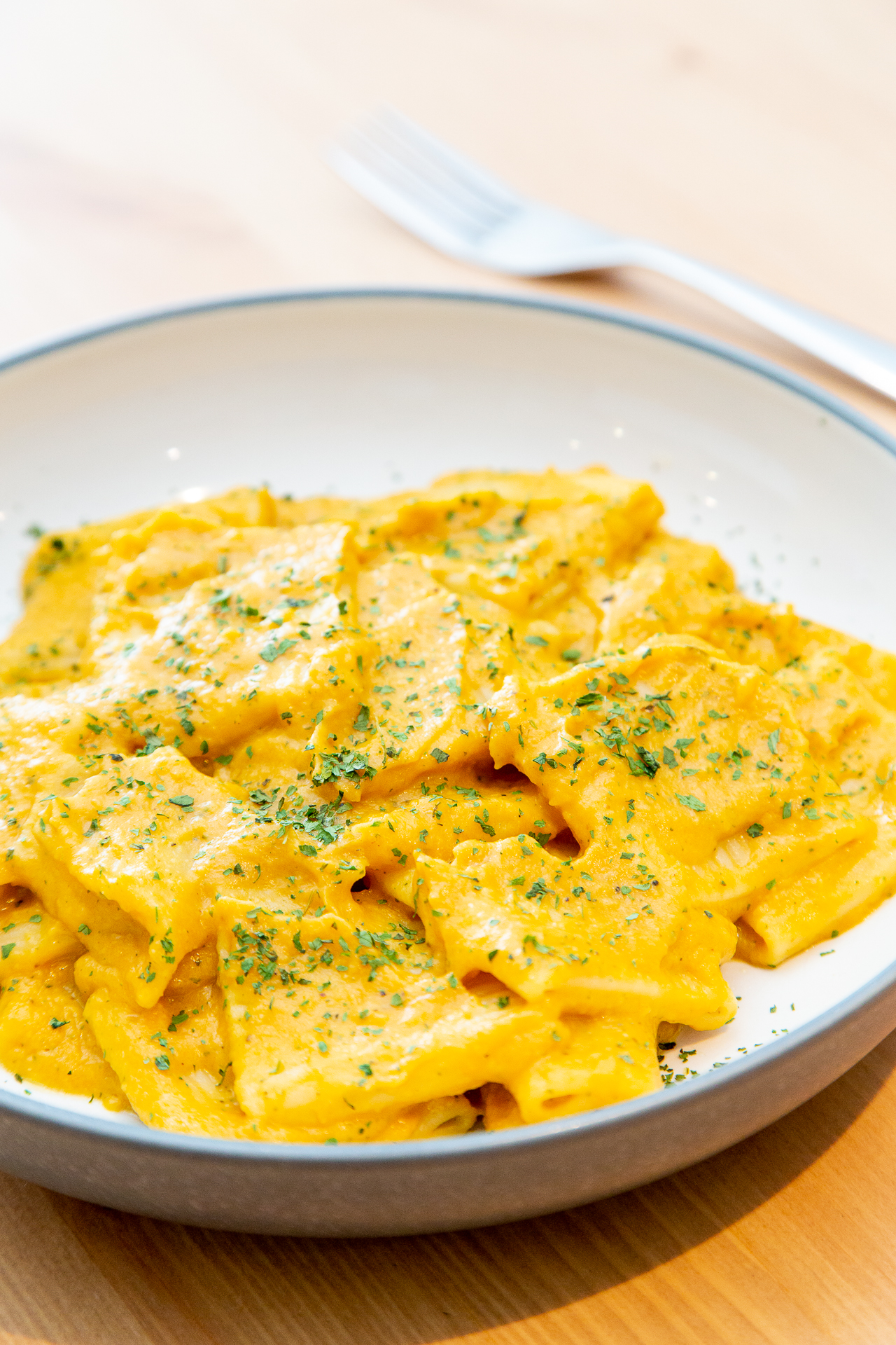 a vegan pasta dish with butternut and swede sauce